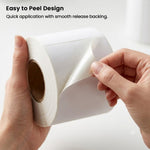 500 white direct thermal labels in Z-fold fanfold stack showing pack depth